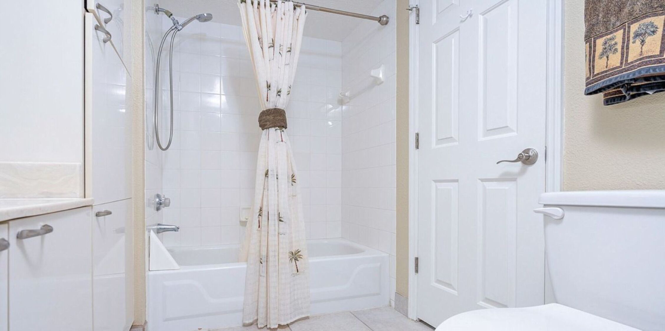 A bathroom with a bathtub, a shower, and a toilet.