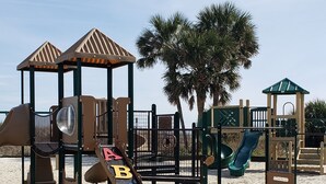A beach playground with slides and climbing structures. - Ocean Views All Decks - 4BR/3BA Stilt Home in Ocean Lakes - 1006 w Golf Cart Opt (Myrtle Beach)