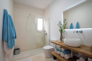 Bathtub, hair dryer, towels, soap