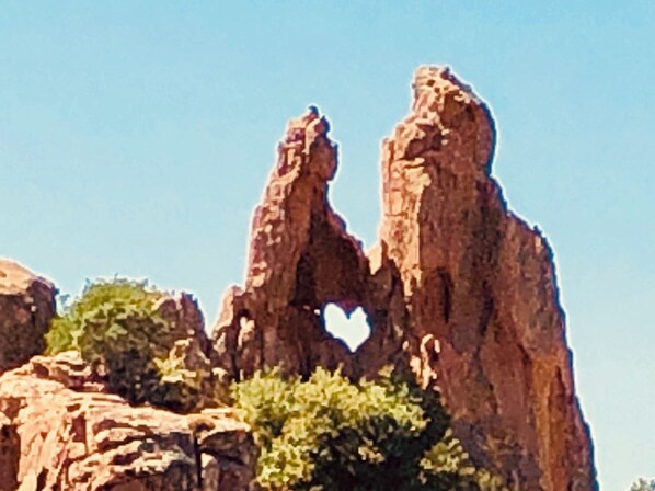 A rock formation with a heart-shaped cutout.