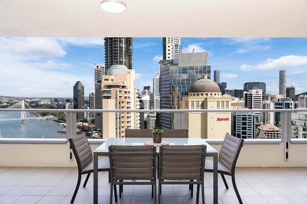 The spacious balcony with spectacular views of the story bridge, Brisbane river, and city
