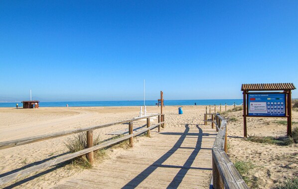 Walk along the beach to the shoreline via the boardwalk.