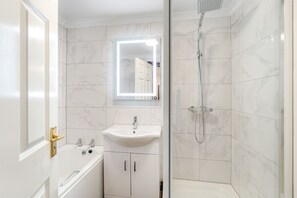Bathtub, hair dryer, towels