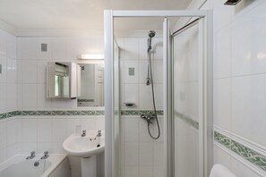 Bathtub, hair dryer, towels