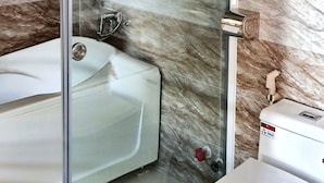 A modern bathroom with a glass-enclosed shower, a white bathtub, and a toilet. - S79 Anh Duc Hotel 2 (Ho Chi Minh City)