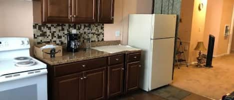 Fridge, oven, cookware/dishes/utensils