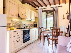 Oven, coffee/tea maker, freezer, dining tables