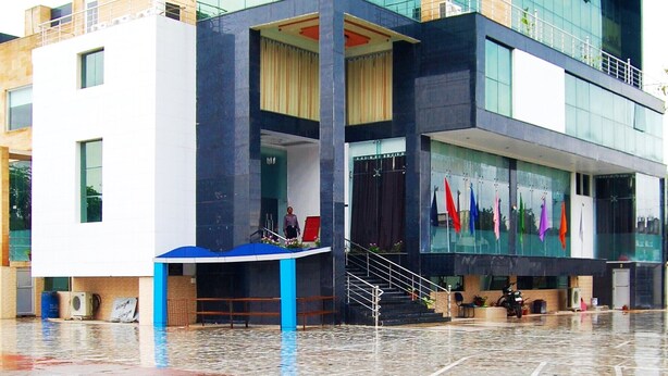 A modern hotel with a prominent sign reading "HOTEL NEELAM RESTAURANT & BANQUET HALL". - Neelam Palace Hotel (Singrauli)