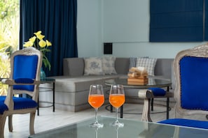 The LR Suite | Living area | 40-cm LED TV with cable channels, TV - Living Room Beach Resort (Morjim)