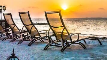 Private beach, white sand, sun loungers, beach umbrellas