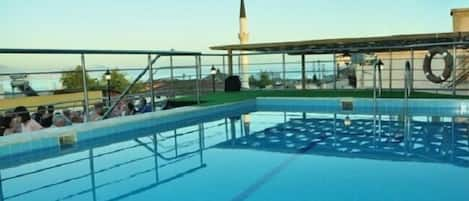 Seasonal outdoor pool, pool umbrellas, pool loungers