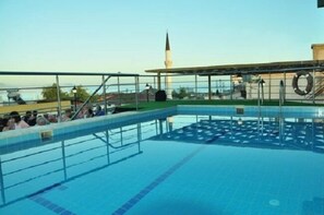 Seasonal outdoor pool, pool umbrellas, pool loungers