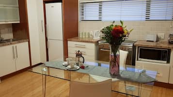 Deluxe Loft, 2 Bedrooms | Private kitchen | Fridge, microwave, oven, stovetop