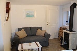 Apartment, 1 Bedroom | Living area | 40-cm flat-screen TV with cable channels, TV, fireplace - Casa Karuza (Pag)