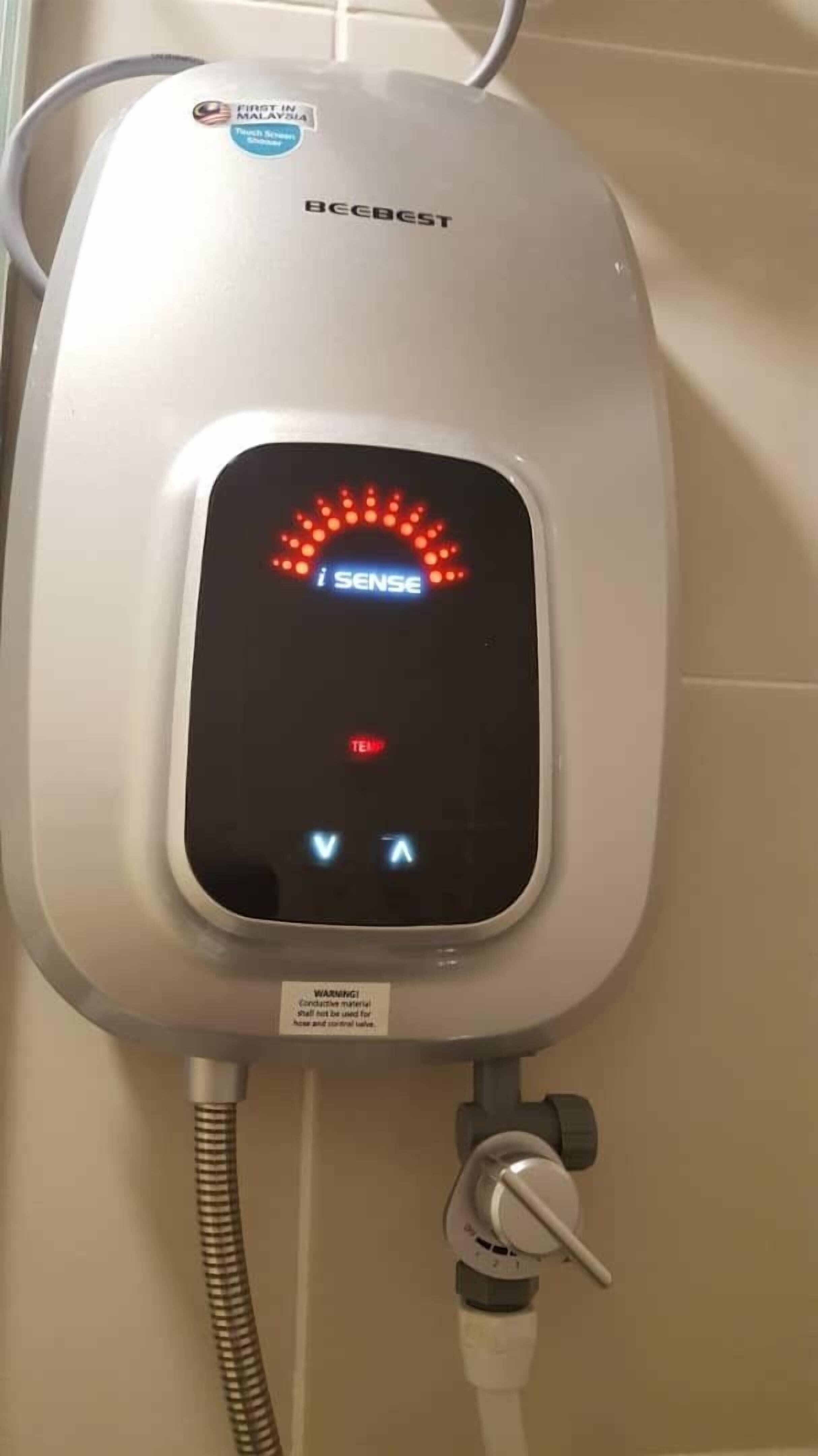 A BCCBEST water heater with a digital display and a warning label.
