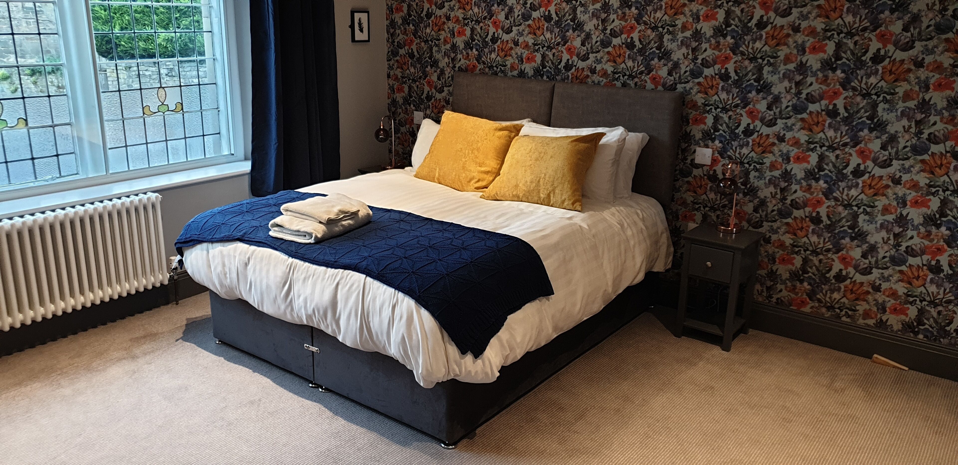 desk, laptop workspace, blackout curtains, iron/ironing board