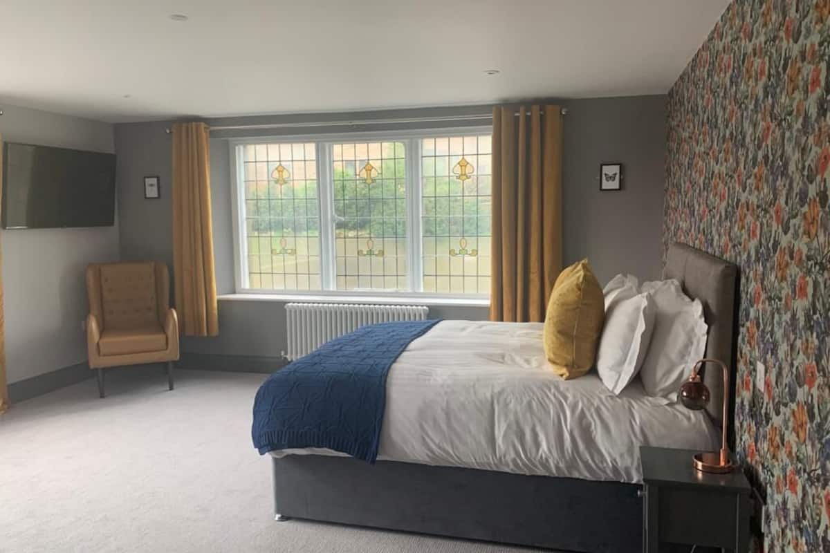 desk, laptop workspace, blackout curtains, iron/ironing board