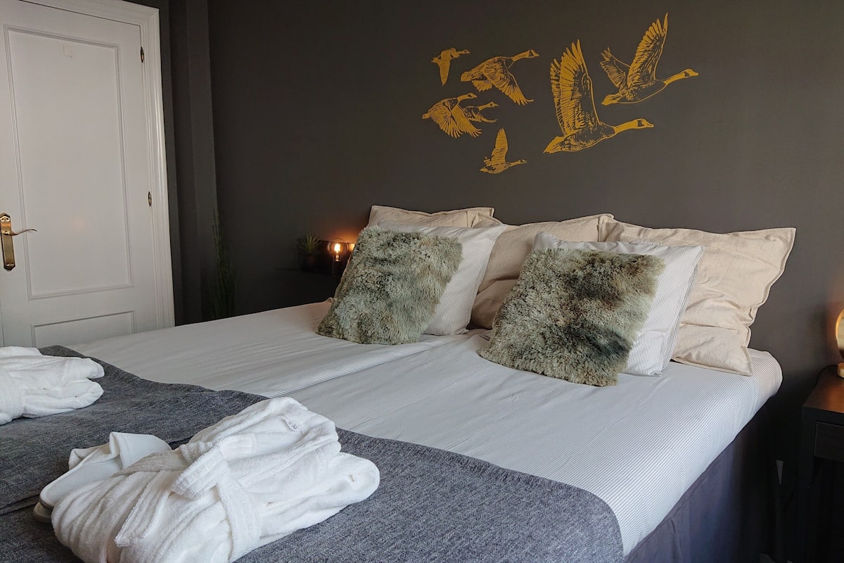 Premium bedding, down comforters, memory foam beds, desk