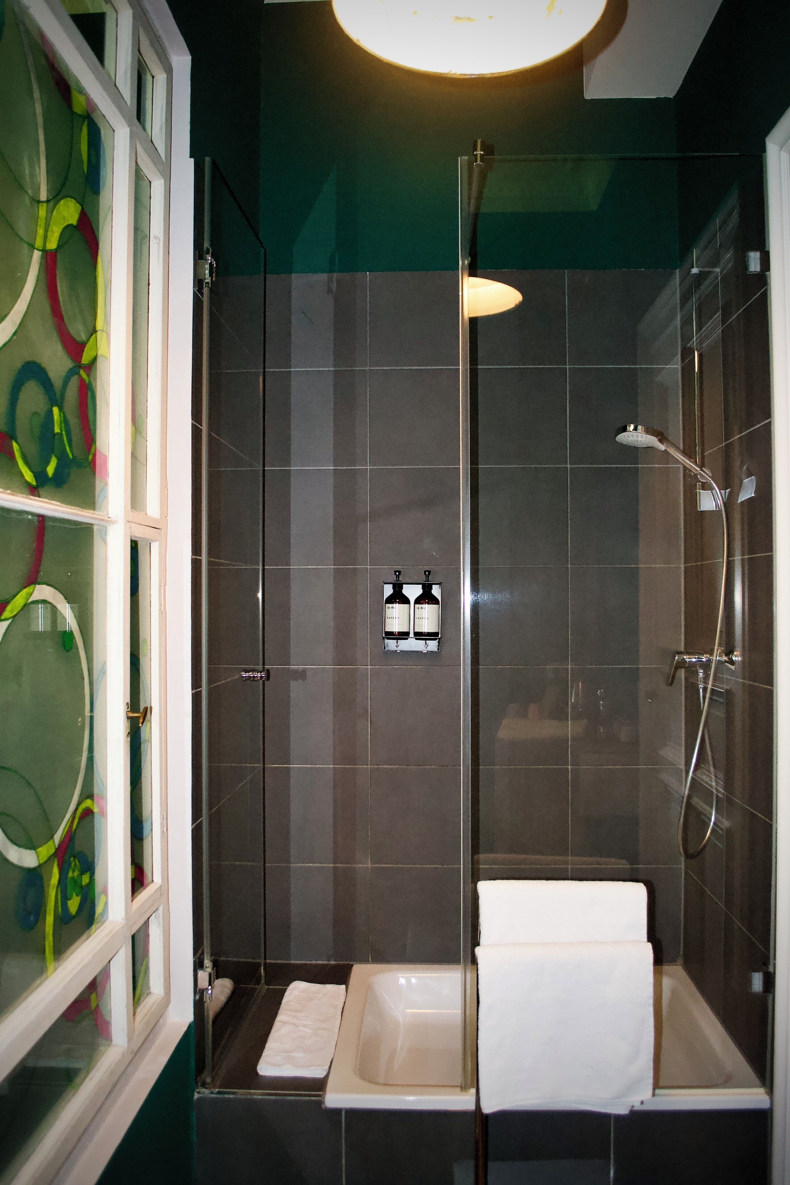 Family Room | Bathroom | Designer toiletries, hair dryer, towels, soap