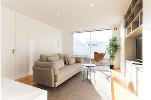 Apartamento, 2 quartos, para não fumantes | Área de estar | TV de tela plana