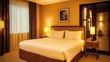 A hotel room with a large bed, two bedside tables with lamps, a large mirror, and a view of a brick wall and a door.