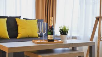 Deluxe Quadruple Room | Minibar, in-room safe, desk, laptop workspace