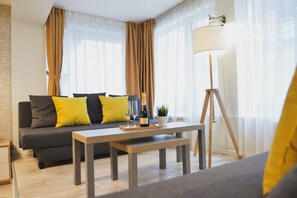 Chambre quadruple Deluxe | Minibar, coffre-fort, bureau