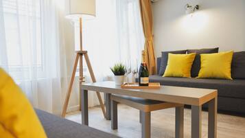 Deluxe Quadruple Room | Minibar, in-room safe, desk, laptop workspace