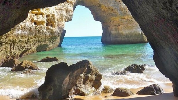 A natural rock arch formation with a view of the sea through the opening. - ATTILA apartment by the sea (QUARTEIRA)