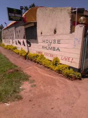A sign for Club Panas House of Rhumba advertising live football broadcasts. - Club Panas (Bondo)