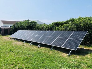 A solar panel array installed outdoors. - Sea Roots "Sea zone" - Amazing sunsets and ocean views (Mosteiros)