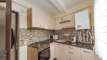 Departamento exclusivo | Cocina privada | Refrigerador con congelador, horno, lavavajillas y cafetera de espresso
