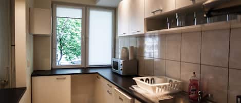 Apartment, 2 Bedrooms | Private kitchen | Fridge, microwave, stovetop, cookware/dishes/utensils