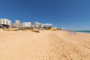 On the beach, sun-loungers
