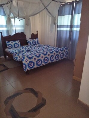 Deluxe Room | Desk, blackout curtains, free WiFi, bed sheets - Jolly Accommodation Centre (Mwingi)