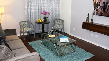 Junior Suite | Living area | Flat-screen TV