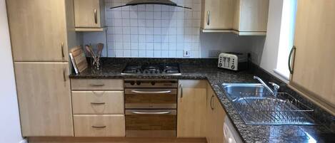 Villa (3 Bedrooms) | Private kitchen | Oven, stovetop, dishwasher, cookware/dishes/utensils