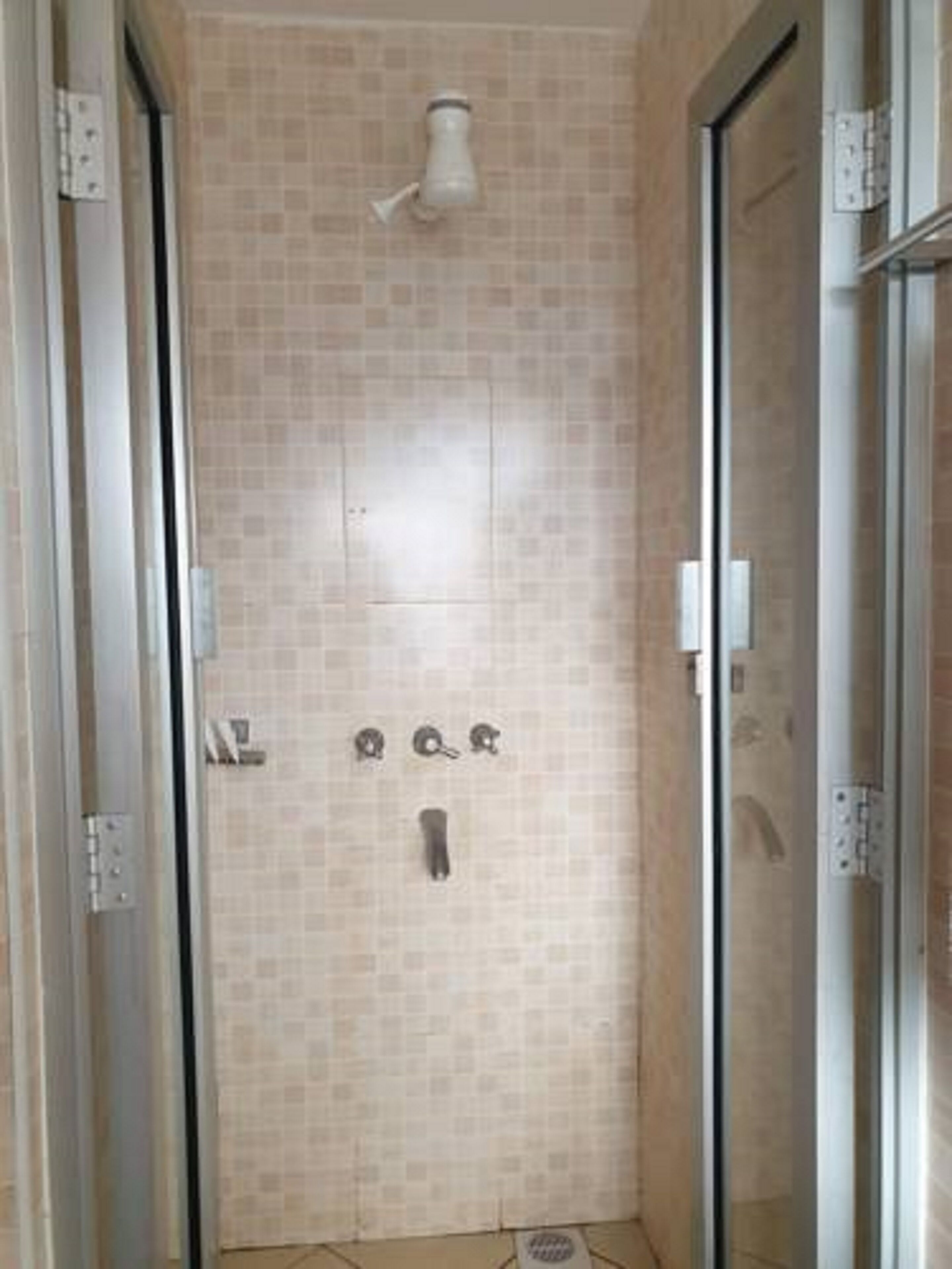 twin room | bathroom | rainfall showerhead, towels, soap, toilet paper