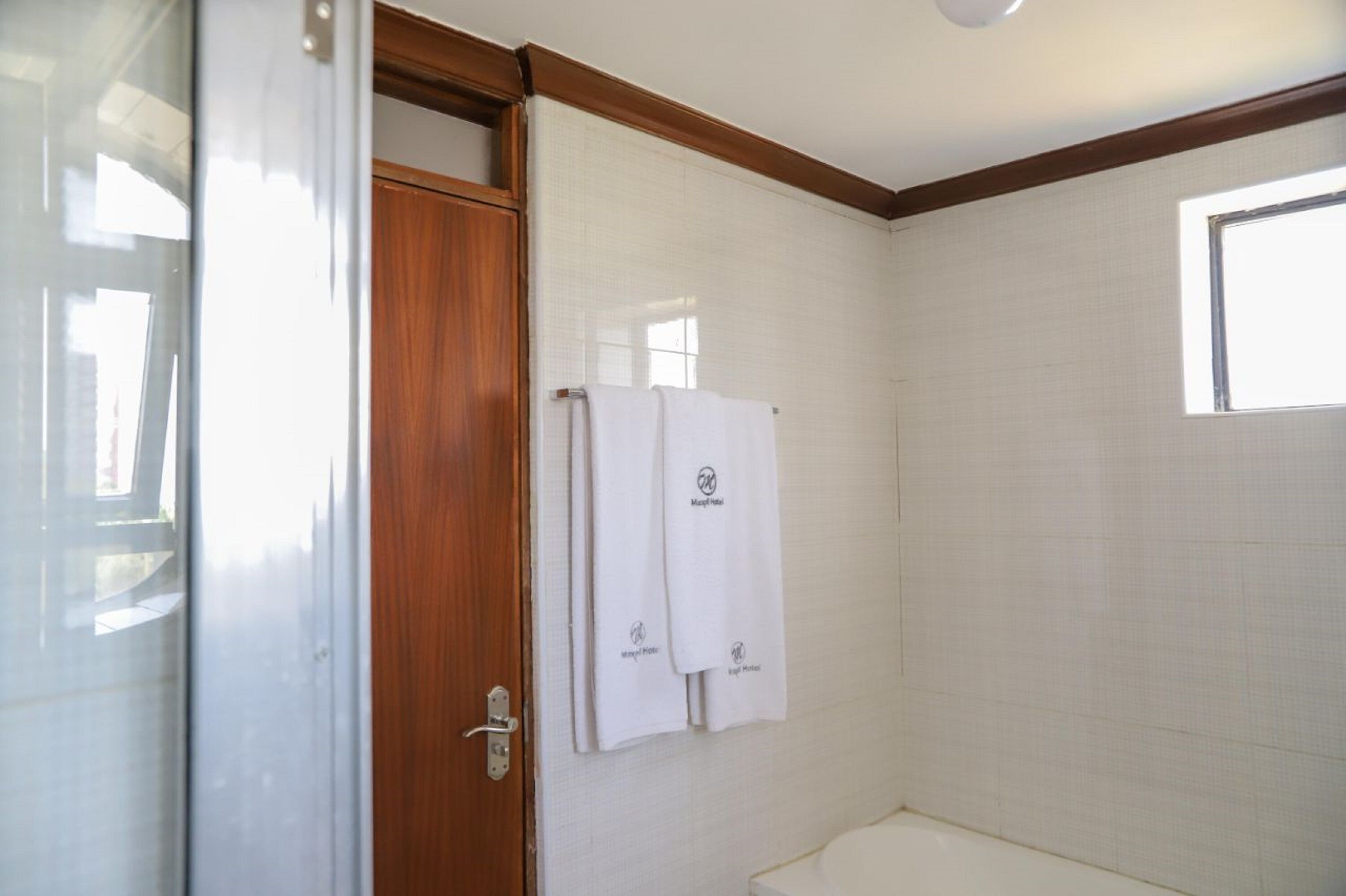 deluxe double room | bathroom | rainfall showerhead, towels, soap, toilet paper