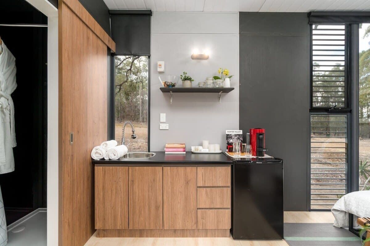 Fridge, microwave, coffee/tea maker, cookware/dishes/utensils