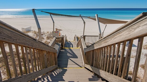 A wooden staircase leading to a beach with a clear view of the ocean. - Beach Front, Renovated Kitchen, Free Beach Chair Service (Miramar Beach)