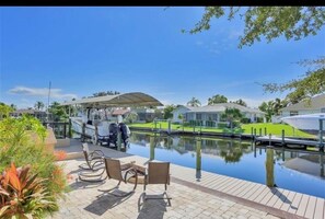 Enjoy waterfront views and access to a boat dock from this serene lakeside retreat.