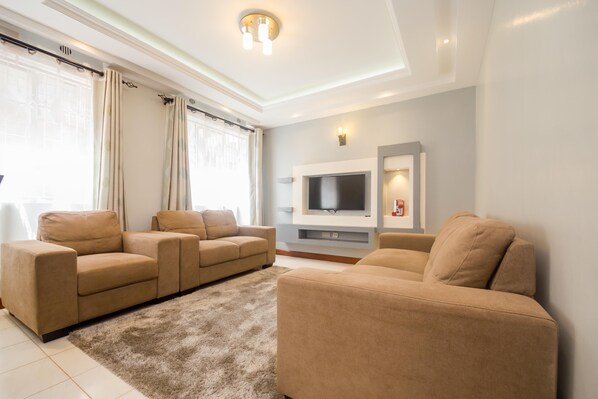 Apartment, 2 Bedrooms | Living area | 42-inch flat-screen TV with satellite channels, TV, DVD player - Esterina Apartments & Fitness Place (Nairobi)