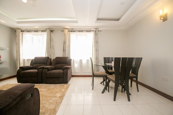 Apartment, 2 Bedrooms | Living area | 42-inch flat-screen TV with satellite channels, TV, DVD player