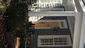 A multi-story building with white-framed windows and a central entrance. - Exclusive Myers Park RNC Rental 4000 sq ft Home - RENOVATED 15 min. to downtown (Charlotte)