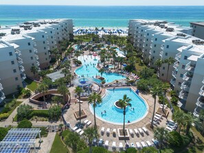 A resort with multiple swimming pools, a beach, and a view of the ocean. - Waterscape B310 - Resort Shores (Fort Walton Beach)