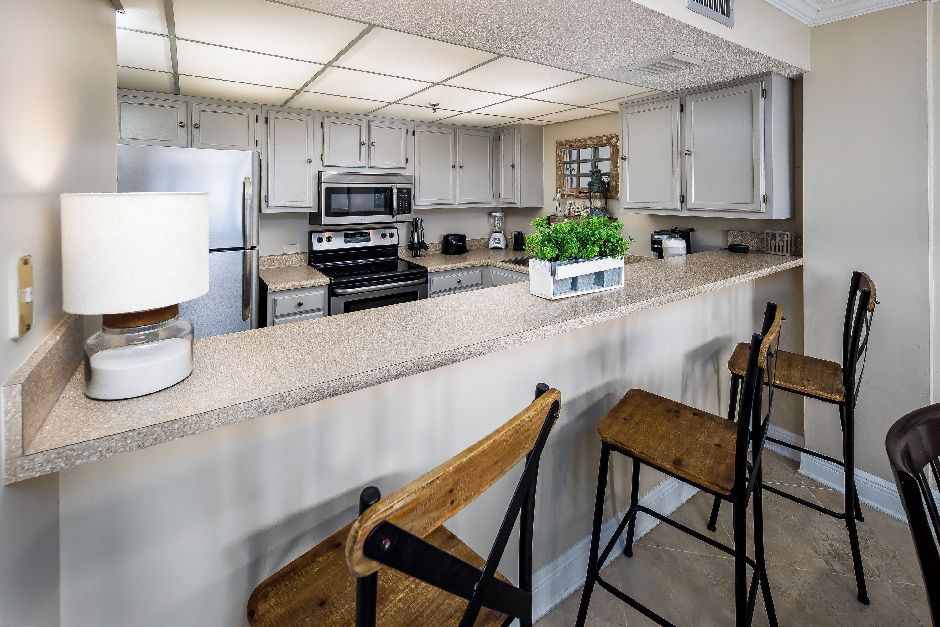 Condo | Private kitchen | Microwave, coffee/tea maker, cookware/dishes/utensils