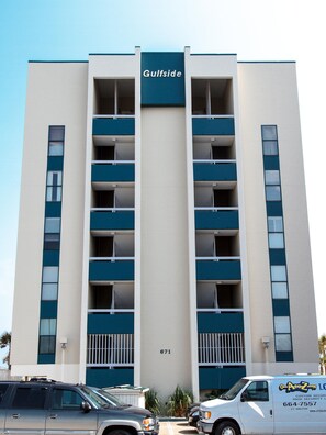 A high-rise building with a sign reading "Gulfside" and the number "671" on the facade. - Gulfside 203 - The Sandbar Escape (Fort Walton Beach)