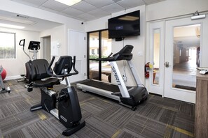 A fitness room with treadmills, stationary bikes, and a rowing machine. - Surf Dweller 208 - Gulfview Oasis (Fort Walton Beach)