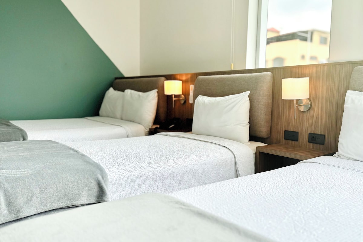 Triple Room | In-room safe, desk, laptop workspace, blackout drapes